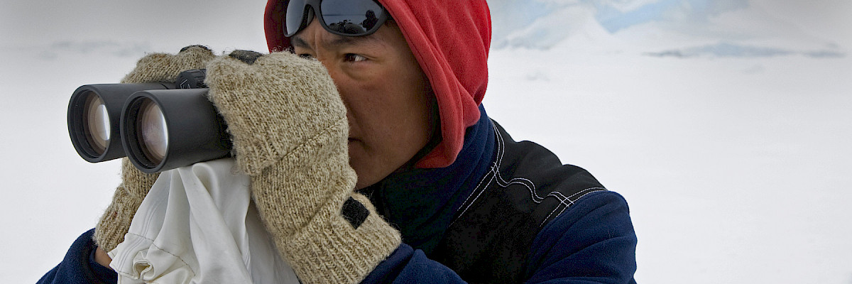 Inuk man with binoculars © Carsten Egevang/ARC-PIC.com Inuk man with binoculars